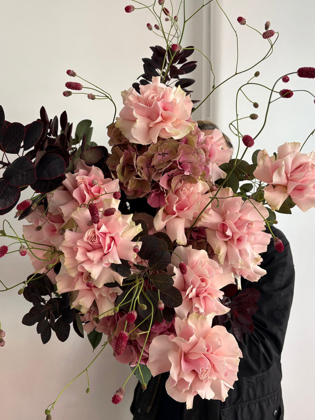 Seasonal flowers and foliage with dark leaves