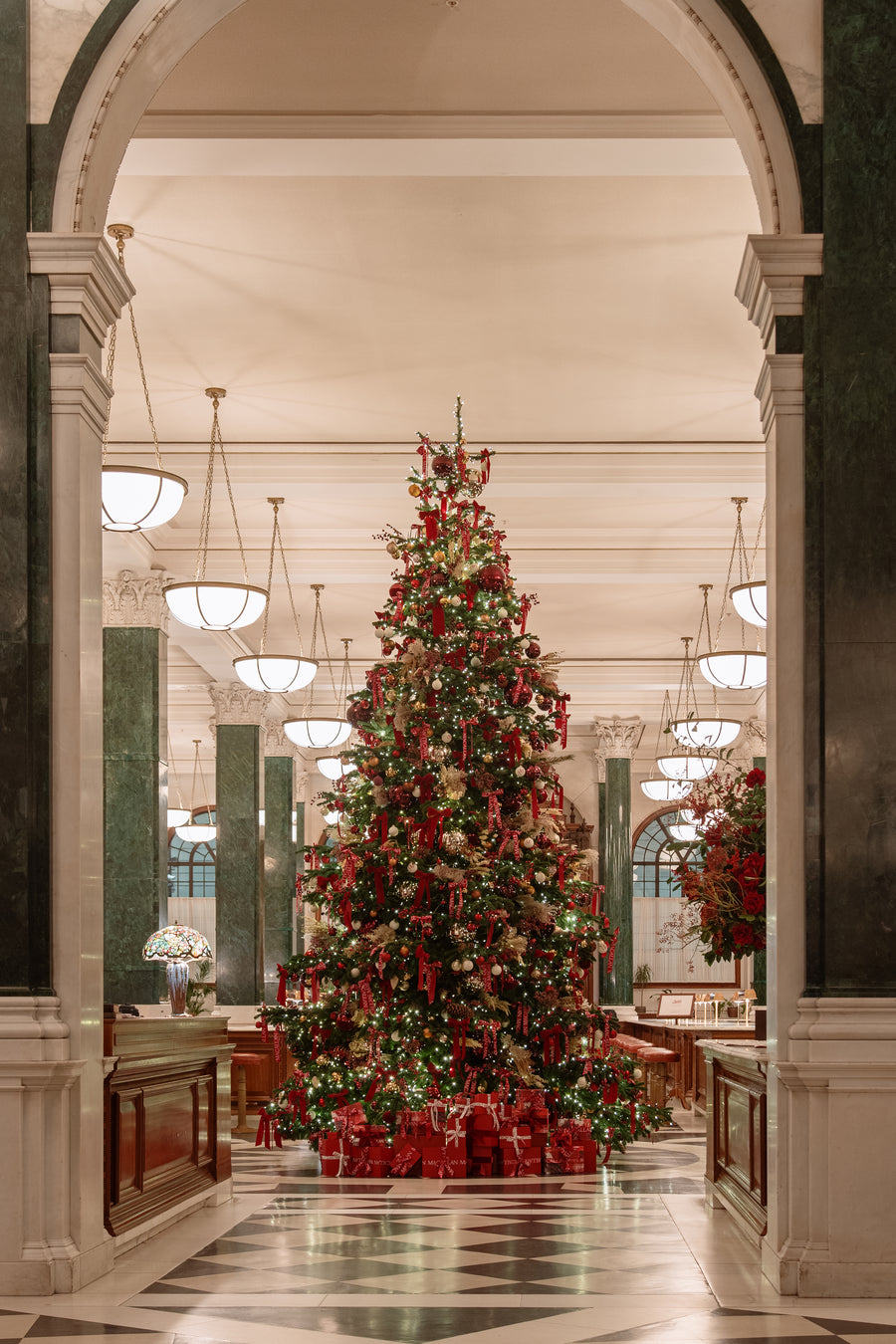The tree from a second angle, with the marble corridor receding behind